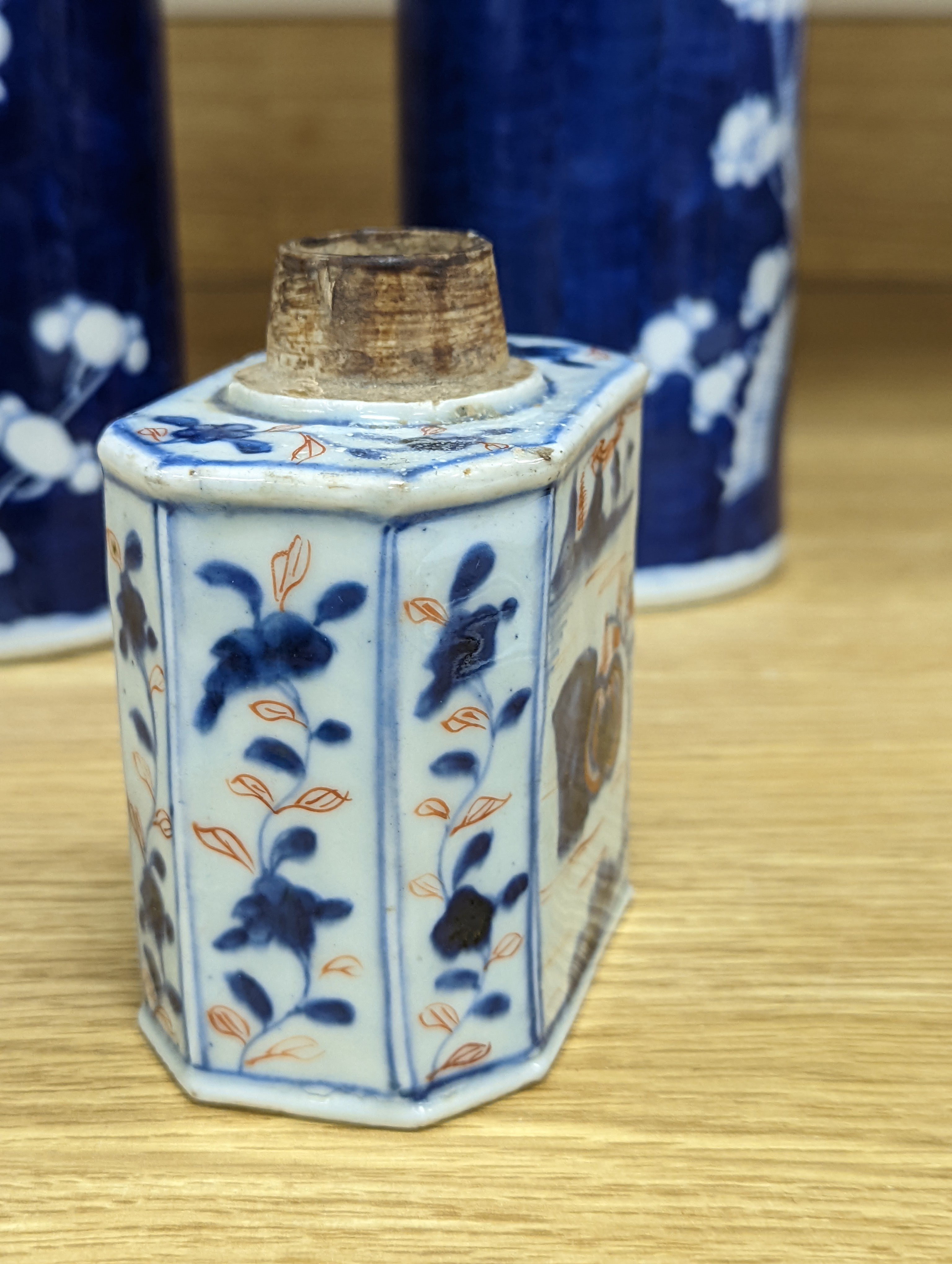 An 18th century Chinese famille rose mug, a Chinese Imari tea caddy and two Chinese blue and white sleeve vases 30cm (4)